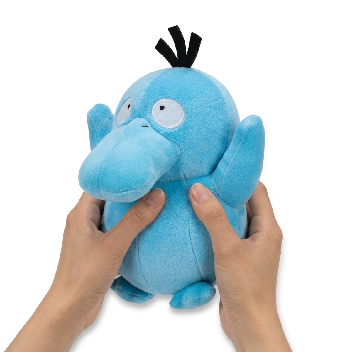 Psyduck Shiny Pluszak vastgehouden in handen