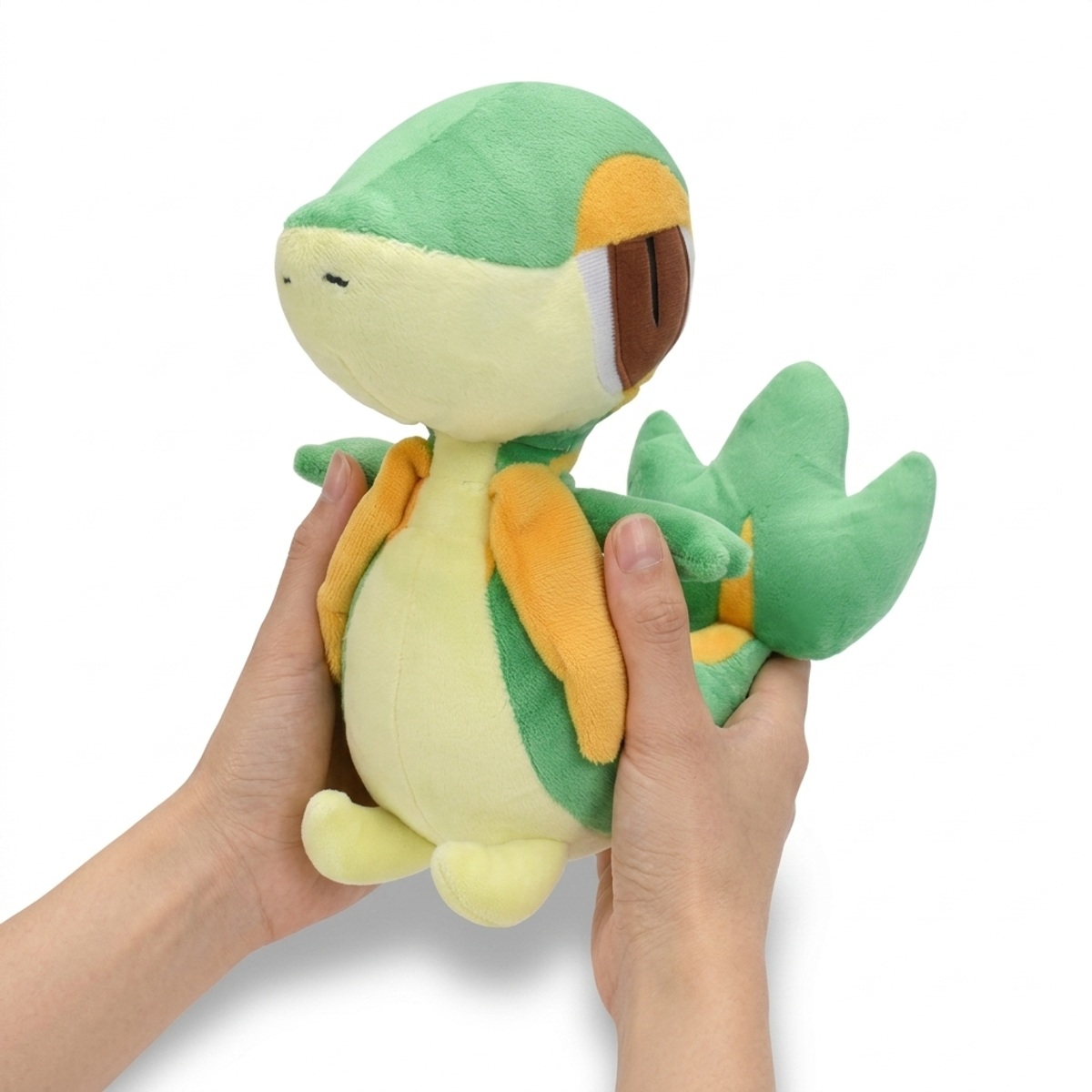 Snivy Pluszak trzymany w rękach