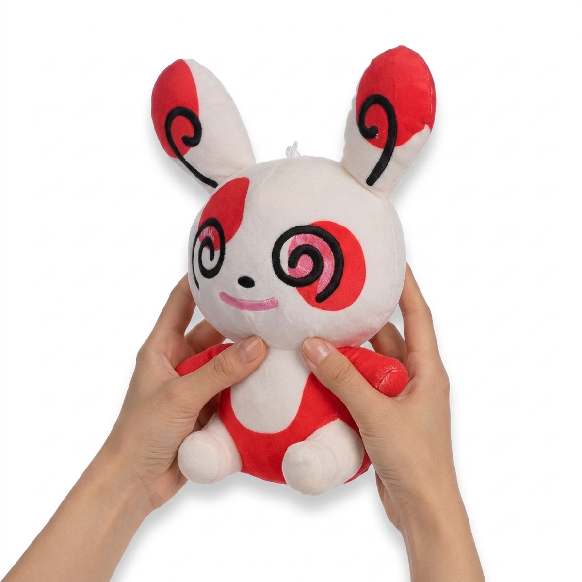 Spinda Pluszak w rękach